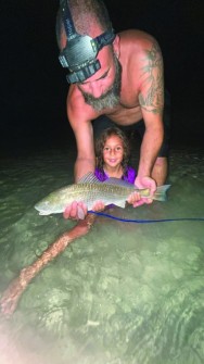 Summer-time fishing is good for Kioma R., shown w/ a nice 20” redfish.
