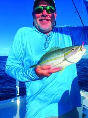 Capt. Terry Fisher putting another client on the bite.