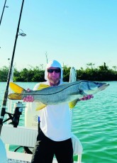 Always in competition w/ his step-daughter, Ryan Robinson shows off his catch.