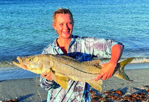 Ashley Heinz’s big slot snook on Englewood Beach. You go girl!