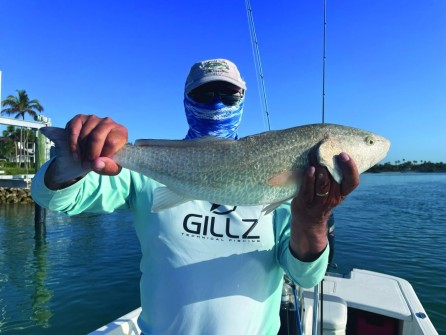 Dave Waldock with a pretty 25” redfish in New Pass.