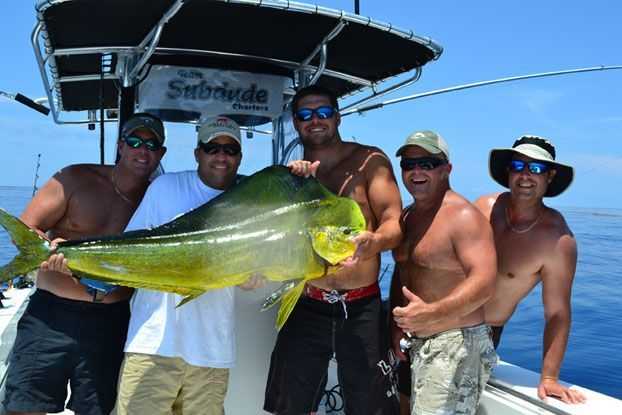 Danny "Reef Donkey" Peterson, Capt Mark Smith, Wade Wells, Shannon Pyle and Tim Kennedy celebrate a 30+ mahi caught by Tim.