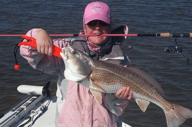 Big Red on a PINK Reel Sassy - Coastal Angler & The Angler Magazine