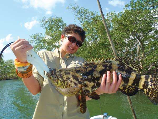 Taylor-with-a-Goliath-grouper