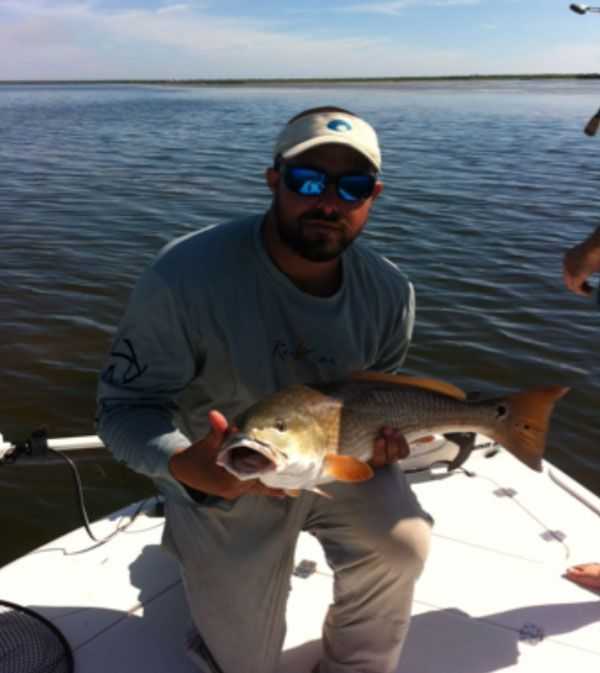 Capt. TJ Belmonte with 30-inch lagoon redfish