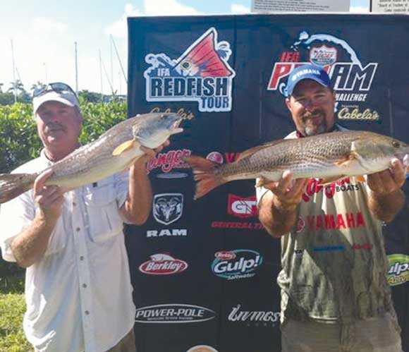 First-place pro angler Greg DeVault (right) and first-place co-angler Paul Klingel (left) show off their winning redfish at the Lucas Oil IFA Pro-Am Redfish Challenge at Punta Gorda, Fla., on Oct. 6.