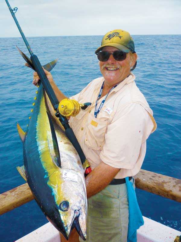 Dale Changnon of Healdsburg hefts one of the quality grade yellowfin tuna he caught aboard the Searcher while field testing the new Penn Torque 2 speed TRQ40NLD2 reel