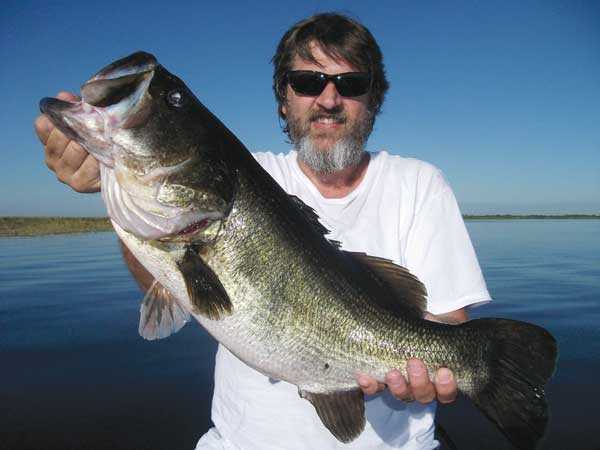 “Bear” Hale, who hails from Indiana, with a great Lake “O” trophy bass caught on a shiner.