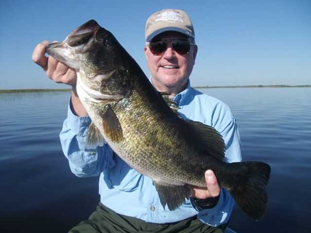Brian Grave from Virginia and a big Okeechobee bass. PHOTO CREDIT: Capt. Mike Shellen.