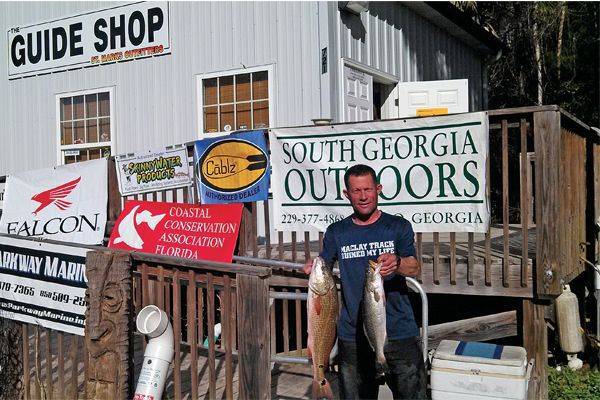 Gary Droze, at the NFGFC weigh in held at the Guide Shop with money  fish!