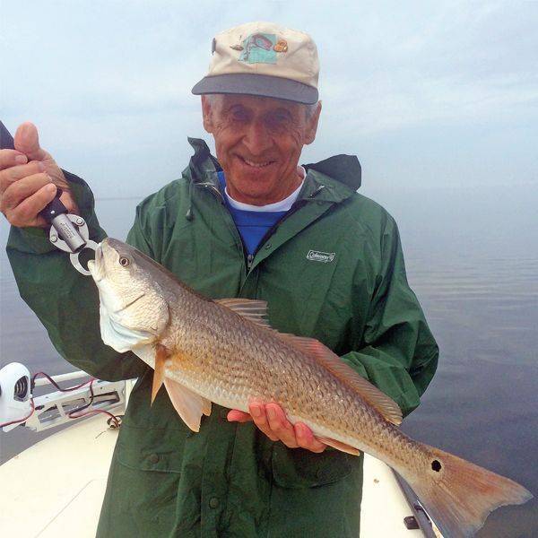 Joel Sheteluk of Deland got this red despite rainy March weather. Photo by Capt. Brian Clancy