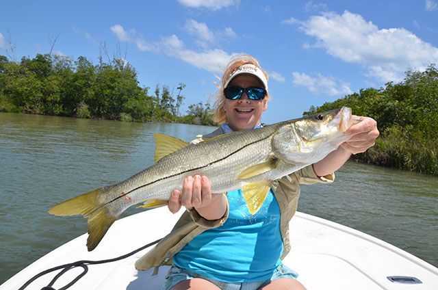 Diane McMahon, from Fort Lauderdale, FL, releases a snook aboard CHAOS at the "Ladies, Let's Go Fishing!" Treasure Coast University May 16-18, 2014. PHOTO SUPPLIED BY; Ladies, Let's Go Fishing.