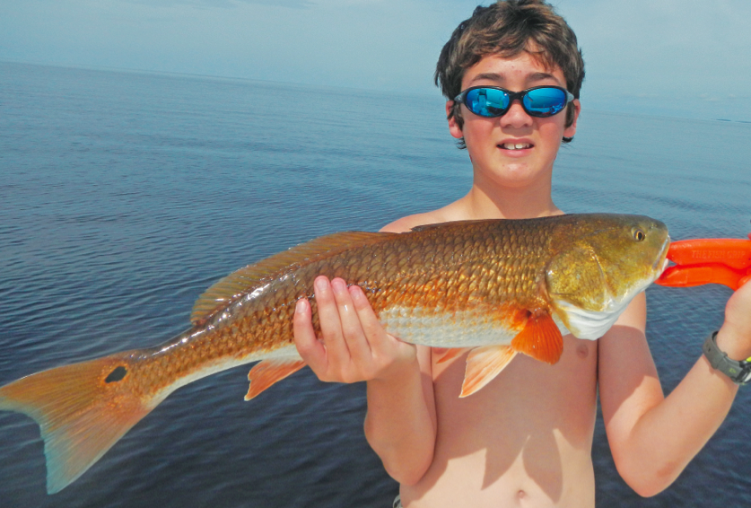 Clay Mc with a beautiful upper slot redfish!
