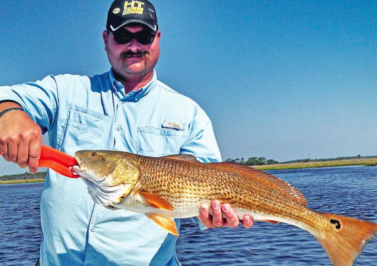 Big Less gets his first topwater redfish, 29 plus inches!