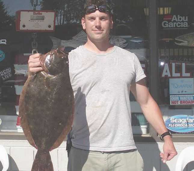 This nice flatty taped out at 24.5 inches and just over 8 pounds. It hit a white 3 ounce bucktail tipped with a piece of squid about 50 feet down current of the edge of a rock pile located off Milford, CT.
