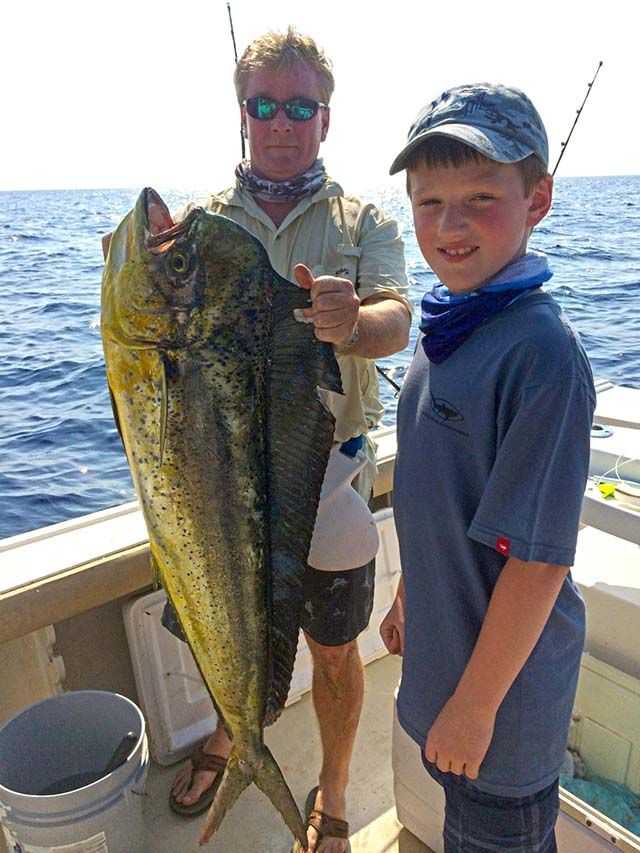 Brayden Burgielwicz, 10, with his first dolphin, a 30-pound bull, caught offshore Stuart aboard Sweet Carolann. PHOTO COURTESY of Bob Greaves.