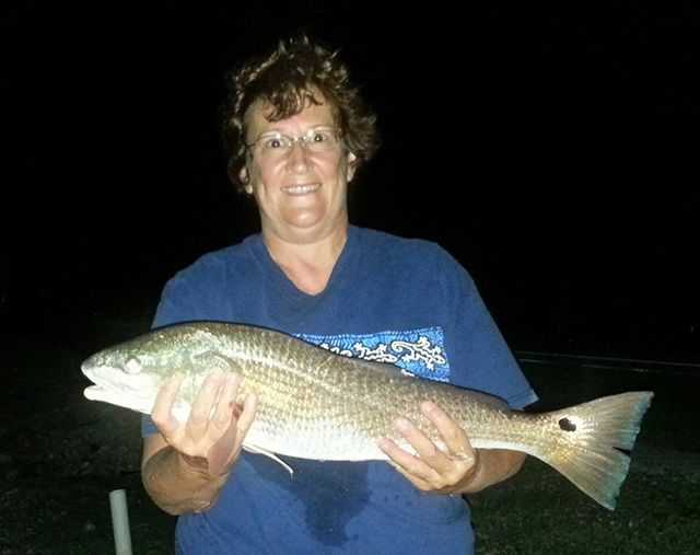 Joanne Spess with a redfish caught on a live shrimp near Herman's Bay. PHOTO COURTESY of Joanne.