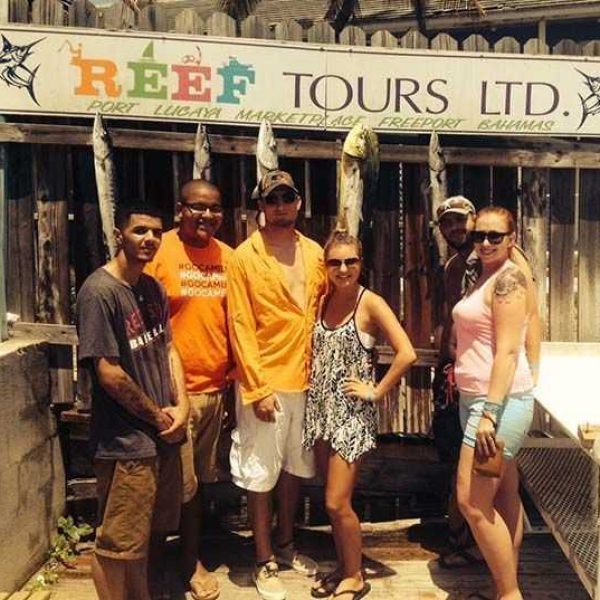 Happy Reef Tour customers with a variety of deep sea catches.