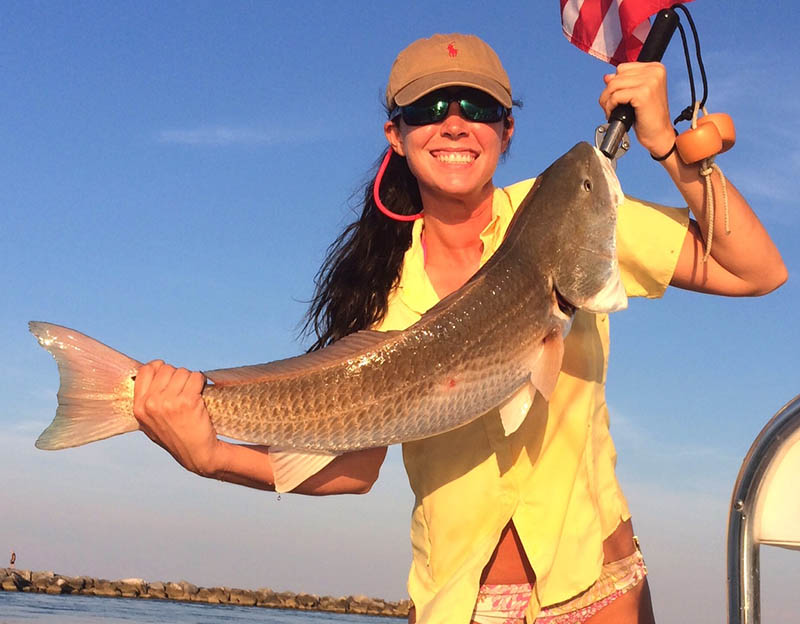 Audra Hatchett with her awesome redfish caught around St. George Island released unharmed