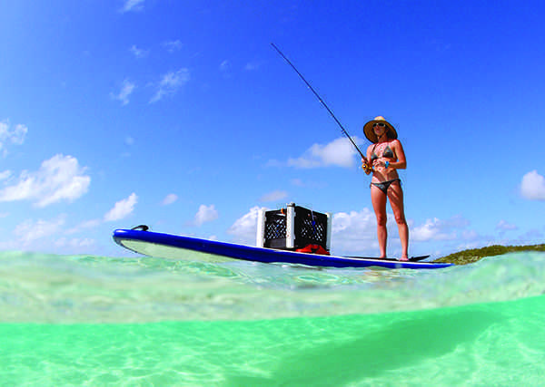 Beautiful woman fishing from paddle board | Coastal Angler ...