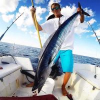 angler holding wahoo