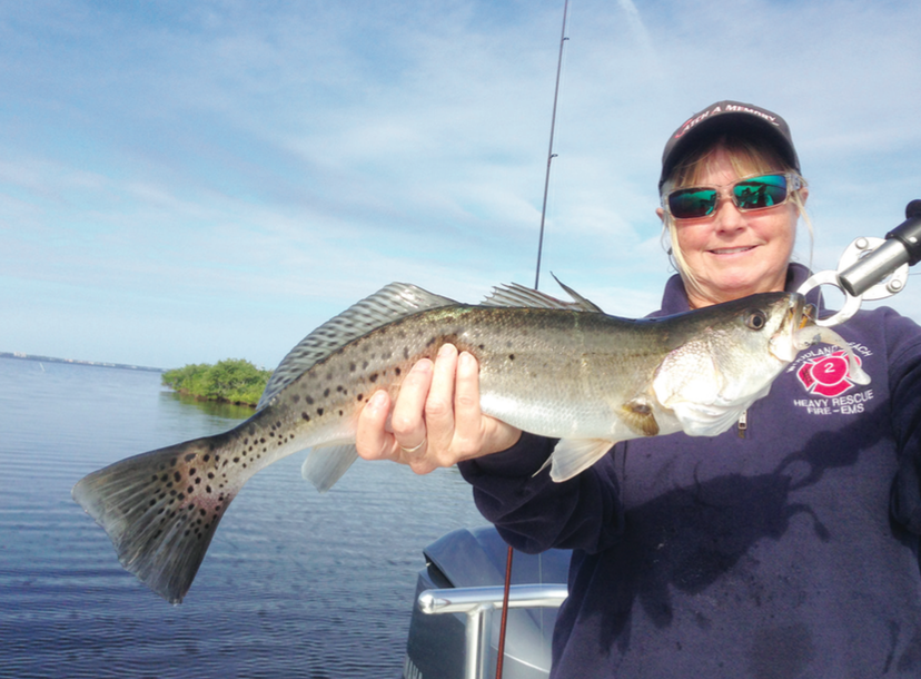 Robin Carpenter of Rockledge with a fat wintertime trout that ate an Albino Ghost colored Saltwater Assassin 4-inch sea shad