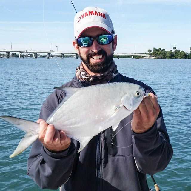 Artie Olsen with a pompano caught at the Fort Pierce Inlet with Doc's Goofy Jigs on a chilly day. PHOTO SUPPLIED by Artie Olsen.