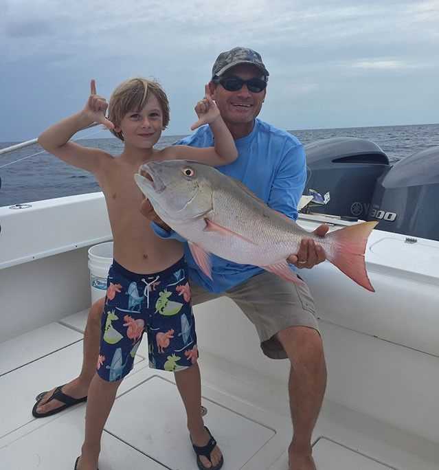 Scott and Thatcher Fawcett with a nice mutton. PHOTO CREDIT: Off the Chain Fishing charters.
