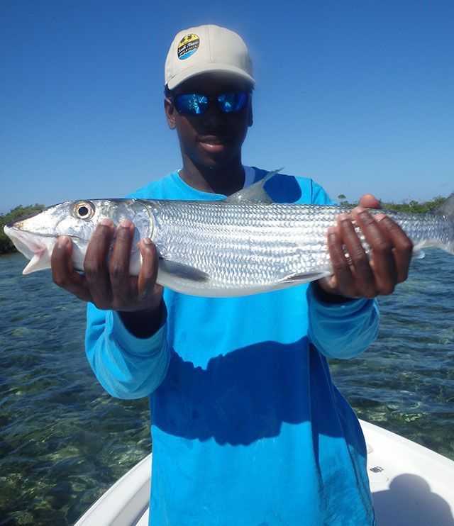 Capt. Mervin Roberts with a South Abaco bonefish. PHOTO CREDIT: South Abaco Adventures.