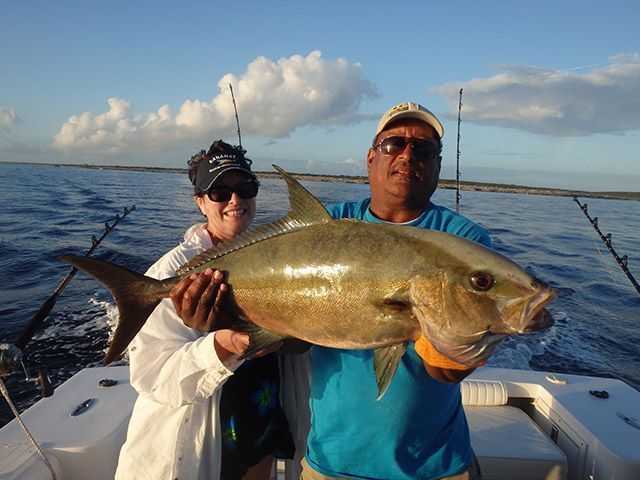 Capt. Hugo Knowles and Susan Lahti with a Hole in the Wall amberjack. PHOTO CREDIT: South Abaco Adventures.