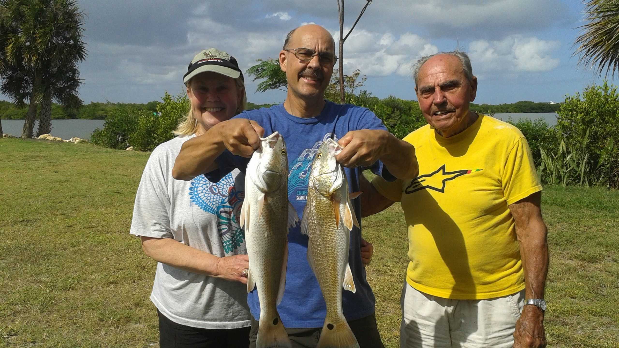 cousins with their redfish catch - Coastal Angler & The Angler Magazine