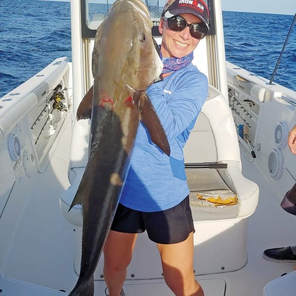 Ally Deming with her personal best cobia—48 in., 55 lbs.—hooked off Sebastian Inlet on the last drift of the day.