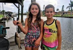 Best friends Logan and Kylah can't get enough of fishing, and worked together to pull this little snapper.