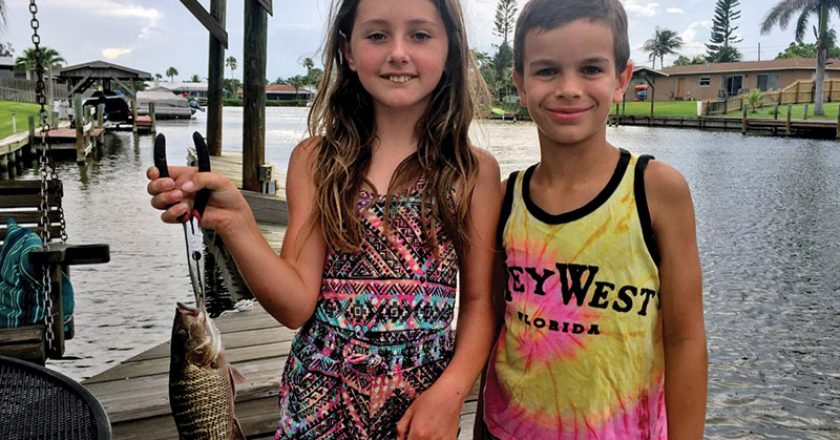Best friends Logan and Kylah can't get enough of fishing, and worked together to pull this little snapper.