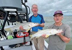 Carl and Larry caught a nice pair of snook as a cold front was coming through.