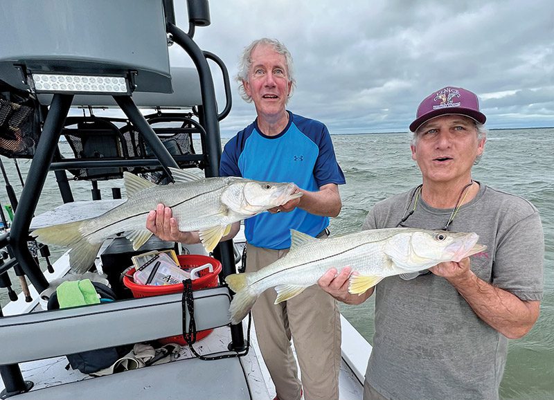 Carl and Larry caught a nice pair of snook as a cold front was coming through.