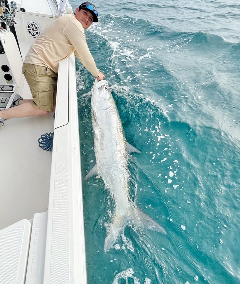 Jose with a big tarpon off the beach!