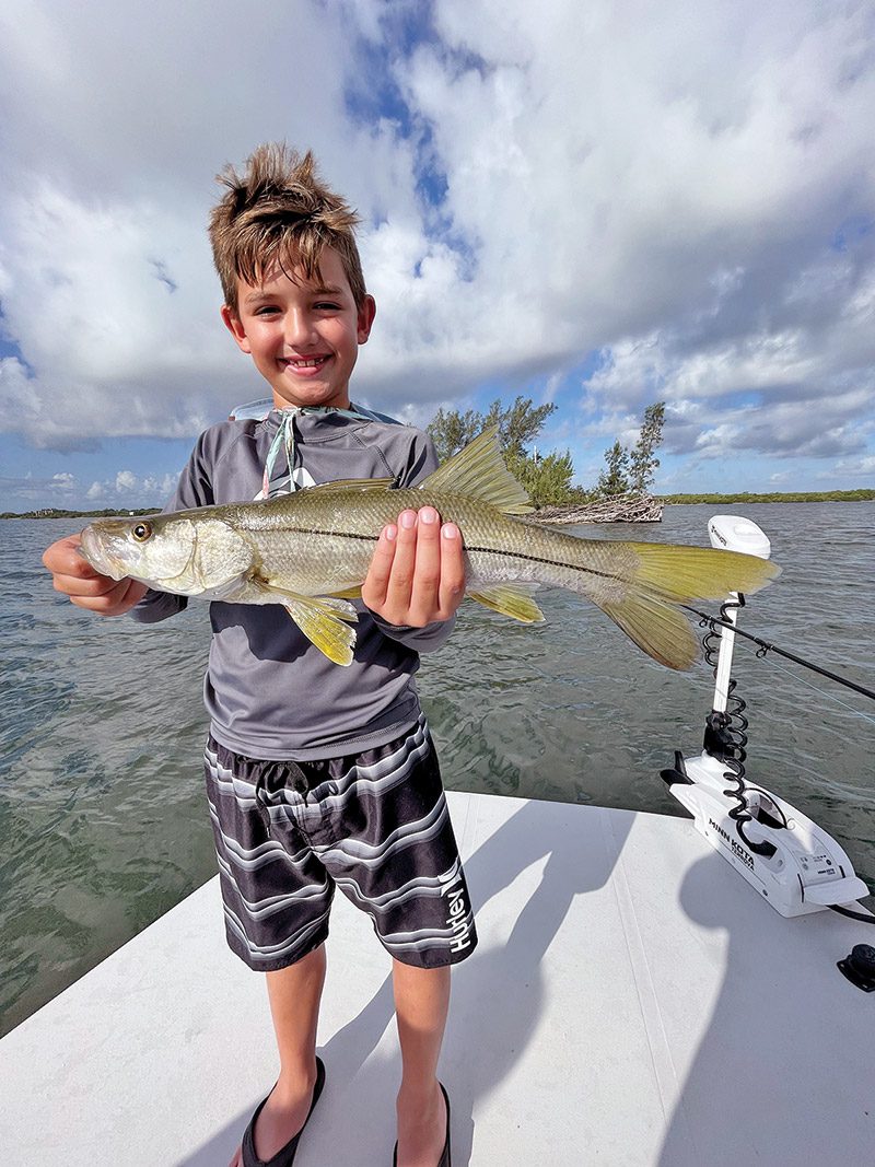 Luke with a snook caught in the Indian River Lagoon!