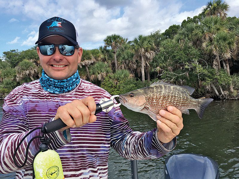 Capt. Justin with a mangrove snapper.