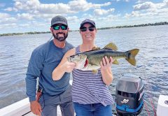 Amy and her first fish ever, a trophy 9 lb. largemouth bass caught on an artificial lure!