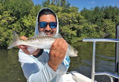 Ike with a speckled trout caught on a Saltwater Assassin sea shad.