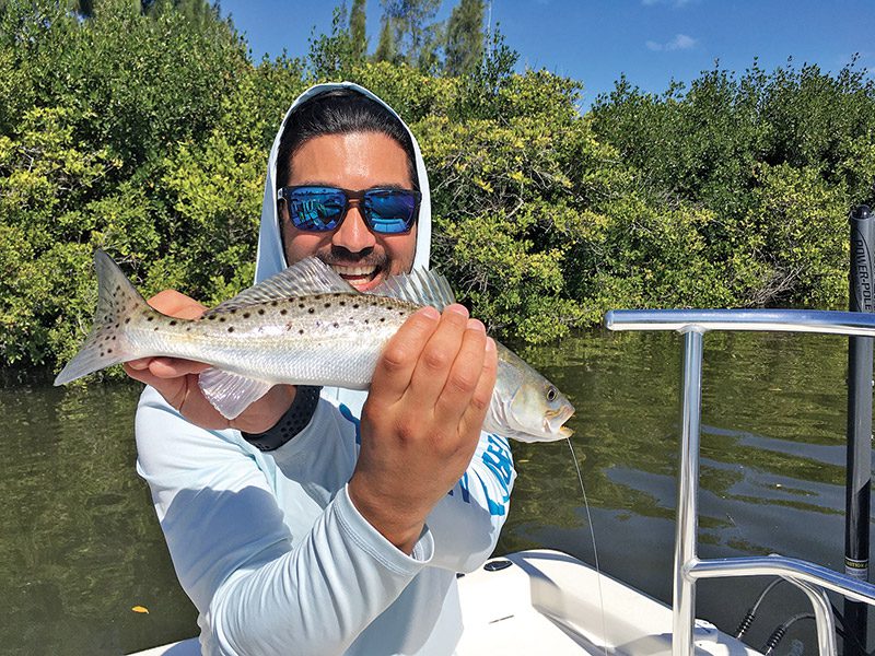 Ike with a speckled trout caught on a Saltwater Assassin sea shad.