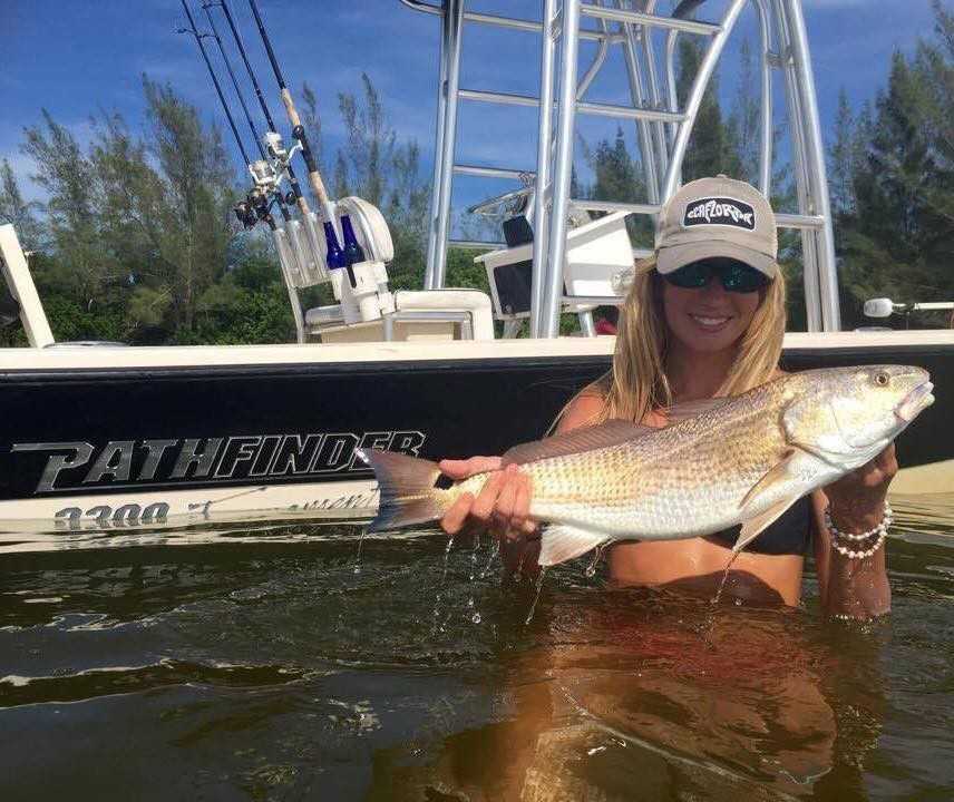 Jena Krone with a redfsh caught in the Indian River Lagoon. Photo Credit: Jess Stanley.