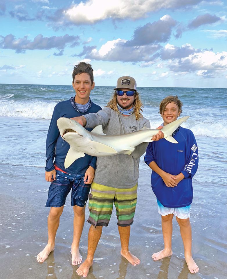 Surf fishing with Capt. Lukas of Cocoa Beach Surf Fishing Chrters, the Brady boys hooked a nice shark!