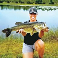 Heather Matson, holding her personal best bass she caught in a Brevard pond.