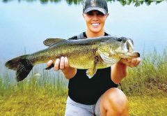 Heather Matson, holding her personal best bass she caught in a Brevard pond.