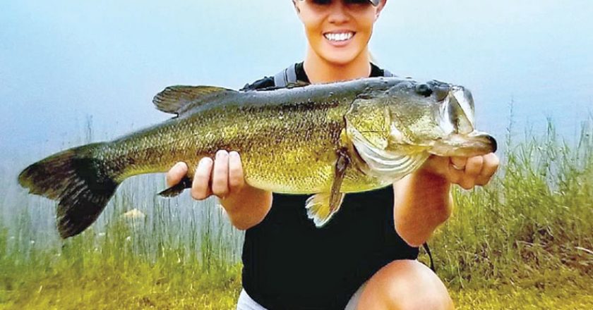 Heather Matson, holding her personal best bass she caught in a Brevard pond.