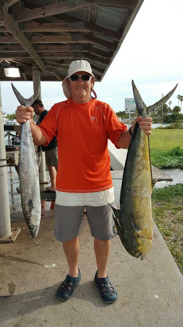 Buddy with a 22-pound mahi caught during the spring mahi run along with a smaller kingfish. Both fish were caught off of Fort Pierce in 80 feet of water using live pilchards. PHOTO CREDIT: Capt. Danny Markowski.