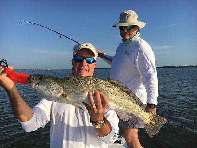 Frank with a nice trout caught on the grass flats in Fort Pierce while enjoying a morning fishing with Rusty. PHOTO CREDIT: Capt. Charlie Conner.
