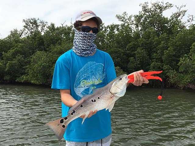 Ethan Wells recently had a banner day fishing with dad, Capt. Pat Wells, and Capt. Charlie. Ethan landed one over slot snook and three redfish, along with some big jacks to make for an exciting morning on the river! PHOTO CREDIT: Capt. Charlie Conner.